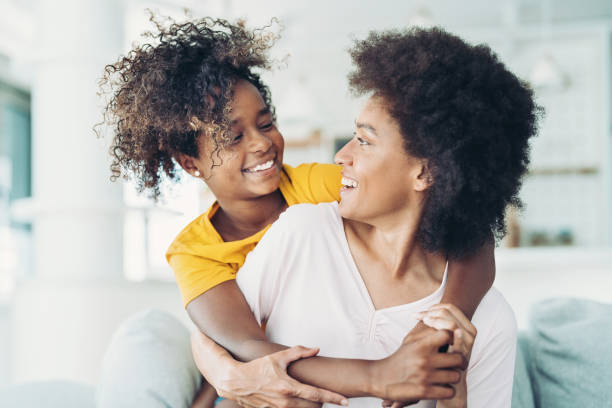 istock Smiling girl hugging her mom 1330966689