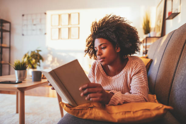 istock African student reading book at home 1330967322