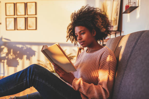 istock African student reading book at home 1330967473