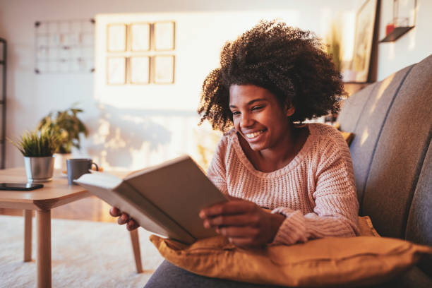 istock African student reading book at home 1330967539