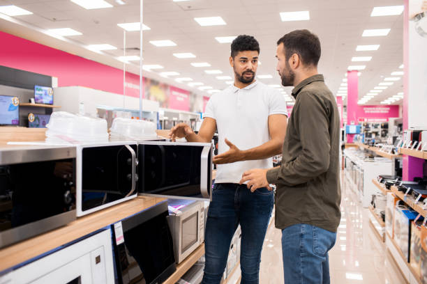 istock Male customer talking to a salesman during shopping 1330967547