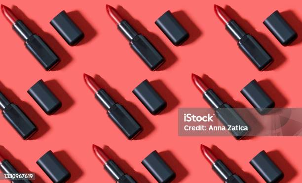 Creative Pattern Fashion Photo Of Cosmetics Beauty Products Red Lipstick On A Red Background Stock Photo - Download Image Now