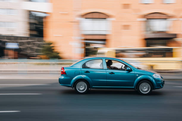 Green Chevrolet Aveo car moving on the street. Ukraine, Kyiv - 16 July 2021: Green Chevrolet Aveo car moving on the street. Editorial Chevrolet stock pictures, royalty-free photos & images