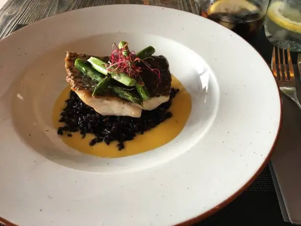 Cod with asperagus and black rice