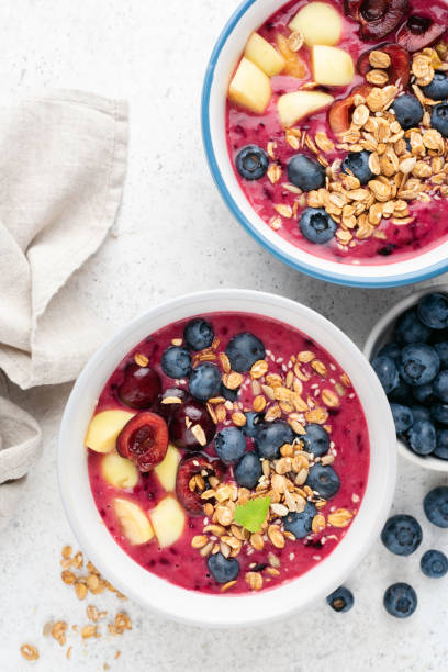 istock Purple acai smoothie bowls with toppings 1330969939