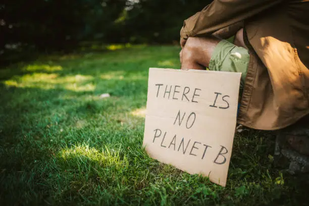 Photo of Young activist / protester. Environmental conservation / Climate change protest.