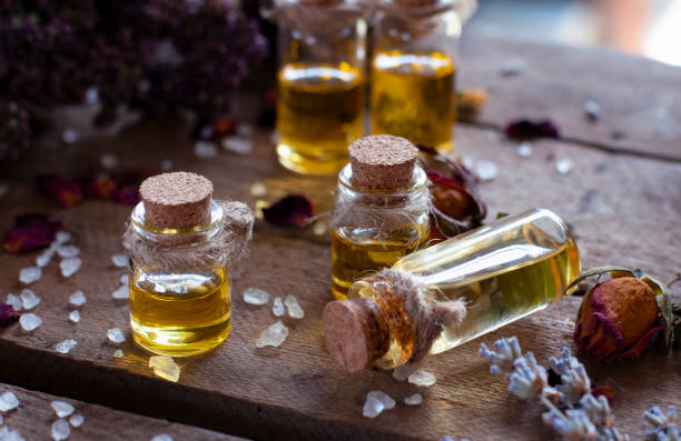 istock Essential oil bottles with dry ingredients for herbal medicine 1330973855