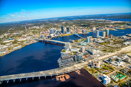 Aerial view of the beautiful skyline of Jacksonville Florida and surrounding areas along the St. Johns River from an altitude of about 1000 feet.