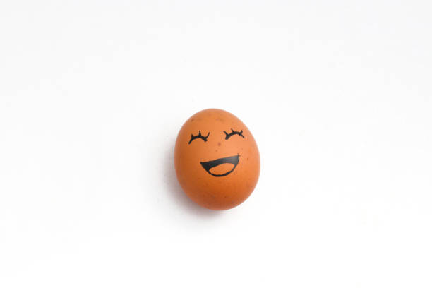 istock brown chicken eggs with happy faces isolated on white background. 1330977044