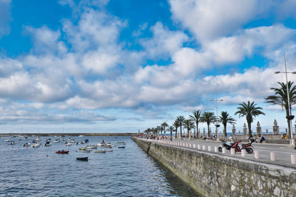 istock Cumulus clouds over the Don Louis Pier in Castro Urdiales 1330977152