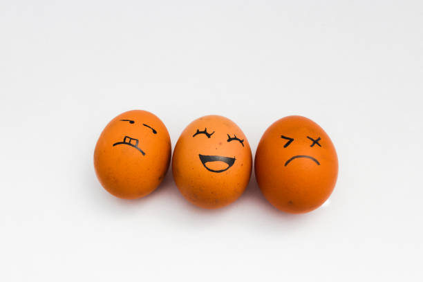 istock brown chicken eggs with happy, annoyed, and tired faces isolated on white background. 1330977171
