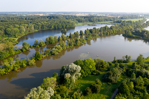 Summer landscape with a river and lakes in a forest viewed from above.