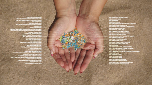 ide view of a woman holding micro plastics in his hands with composition infographics. Non-recyclable materials. Selective focus of microplastics. Global warming and climate change concept. microplastic photos stock pictures, royalty-free photos & images
