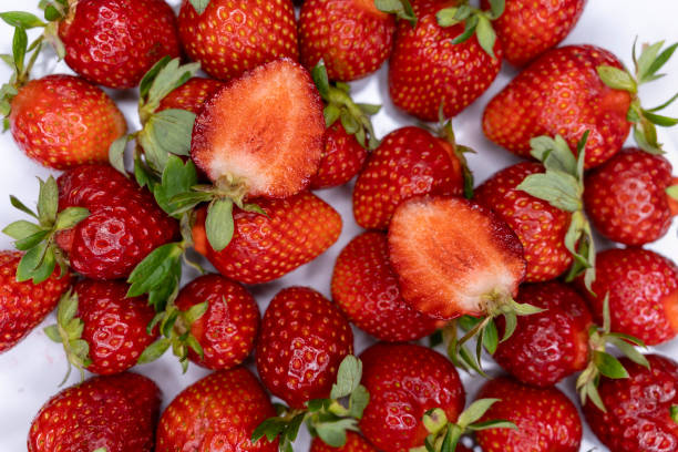 istock Juicy beautiful red strawberries. Sliced sugar strawberries. Background with 1330980129