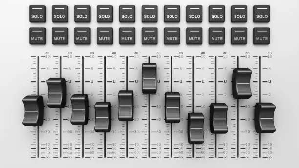 Photo of Studio sound mixer console, board panel with faders and adjusting knobs. Digital equalizer. Volume control sound mixer.