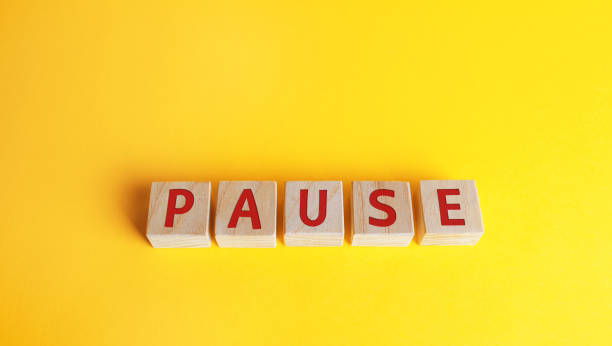 istock Wooden blocks with the word Pause. Break time concept. A break during work. Time to relax and recharge. Stop the business process 1330982425