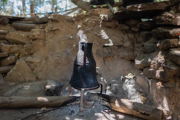 Boiling water in the Old iron kettle on the bonfire