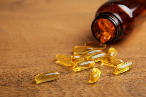 istock Omega 3 capsules on the table close-up with place for text. 1330986232