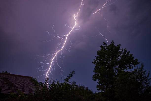 Awesome Lightning Strike Over Rooftops stock photo