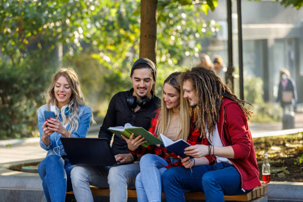 istock Young Students are Working on a Laptop in a Public Park. 1330989150