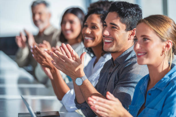 istock Group of business people applauding a presentation. 1330989176