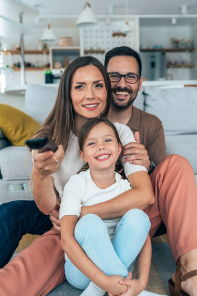 istock Family watching television 1330989248