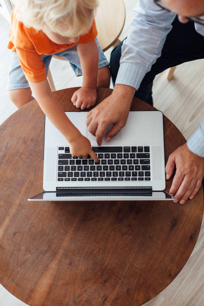 istock Grandfather And Grandson Using Laptop 1330990142