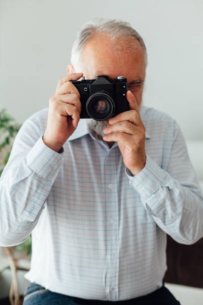 istock Senior Man Taking Pictures 1330991244