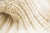 istock closeup beige knitted woolen fabric background 1330997419