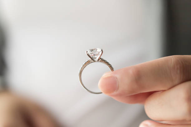 istock hand hold beautiful jewelry diamond ring 1330997423