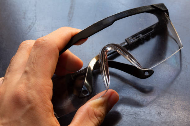 istock hand holding protective glasses quarantine concept and medical equipment 1330997497