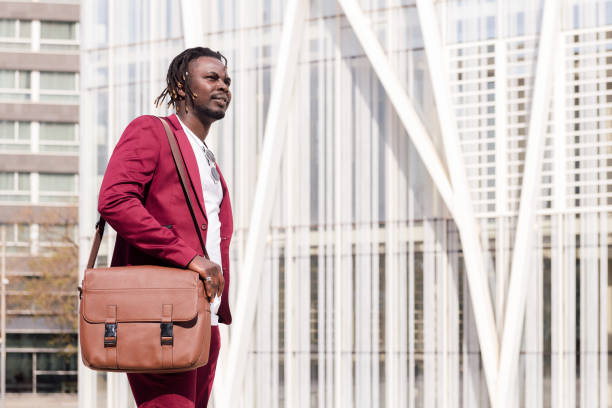 istock businessman with briefcase walks through city 1330997843