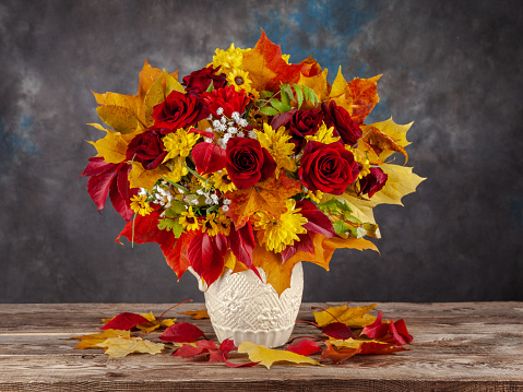 Beautiful dahlia flowers in a vase, abstract floral arrangement, autumn background with space for text, minimal holiday concept, still life, postcard. Happy birthday, wedding, selective focus