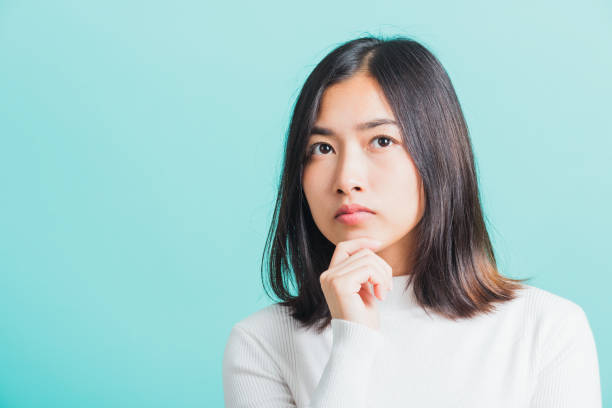 istock woman hand near the face and thinking 1331017733