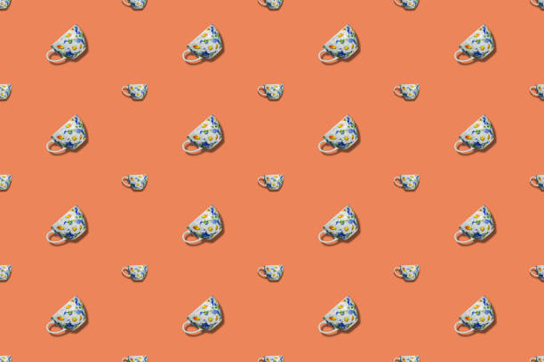 seamless pattern with fresh coffee in cups and saucers on grey background