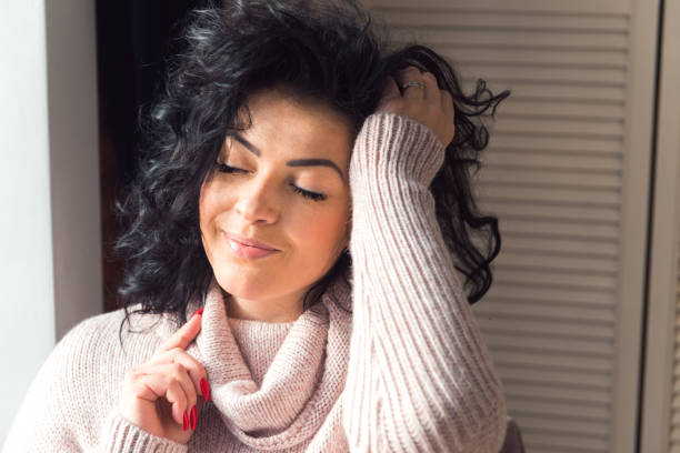 istock Attractive woman brunette posing at home interior 1331022350