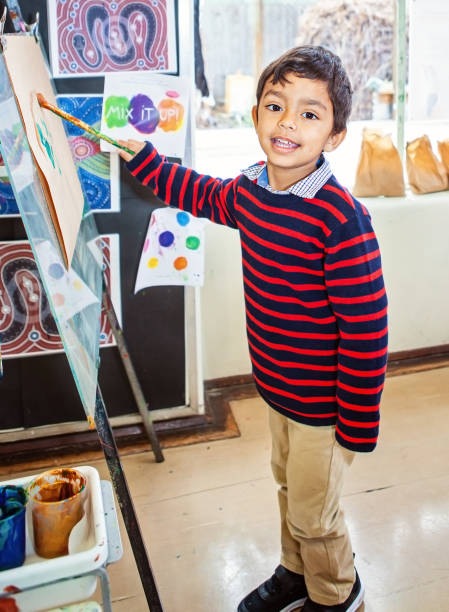 istock Happy child painting 1331024550
