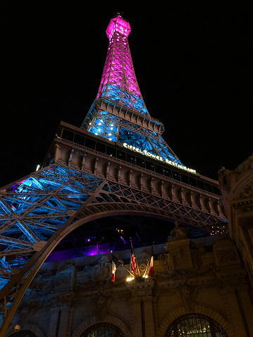 Las Vegas, USA - Sep 28, 2019:  The Iconic Paris Hotel and Casino illuminating Las Vegas Boulevard early in the evening.