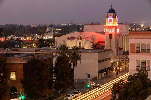 Bakersfield, California, USA - December 01, 2020: Twilight view of traffic passing through downtown Bakersfield.