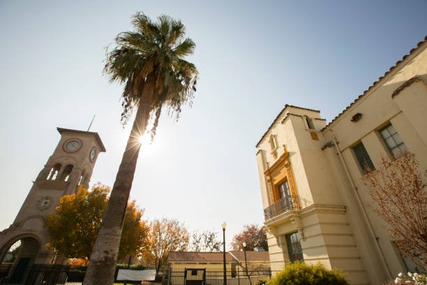 Daytime view of a historic public clock tower in downtown Bakersfield, California, USA.