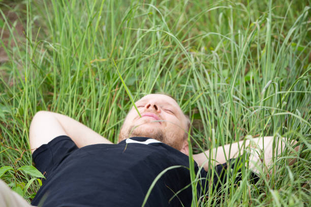 istock Caucasian hipster  lying on grass, relax, happyness concept 1331045474