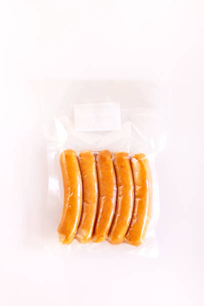 istock Chicken sausage in vacuum package isolated on white background. 1331046275