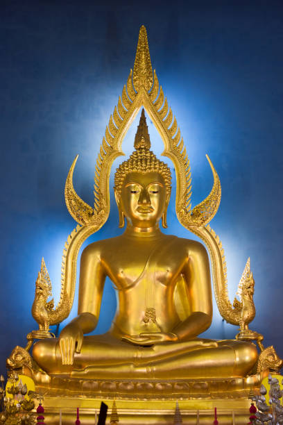 istock A Buddha statue in the Benchamabophit temple, on a blue background. 1331046294