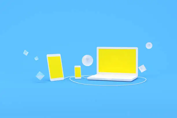 Photo of 3D rendering of laptop computer and smart phone with yellow screen, Computer Software and Services concept.
