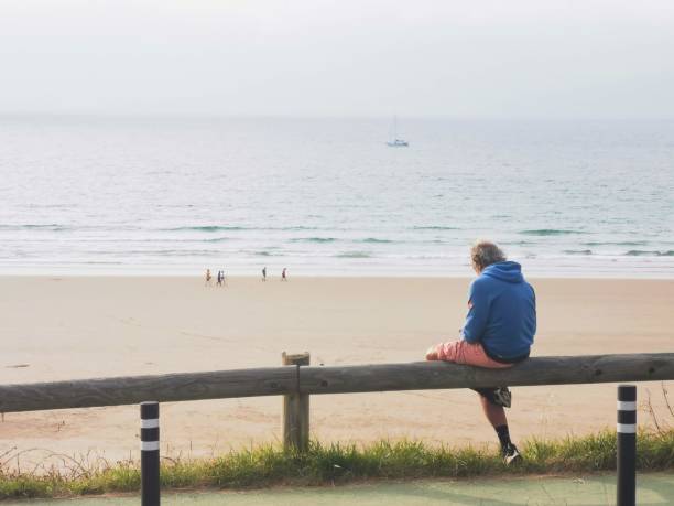istock Man enjoying the view of the beach 1331049978