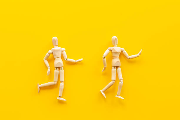 istock Personal communication concept. Two wooden mannequin figures connection 1331050173