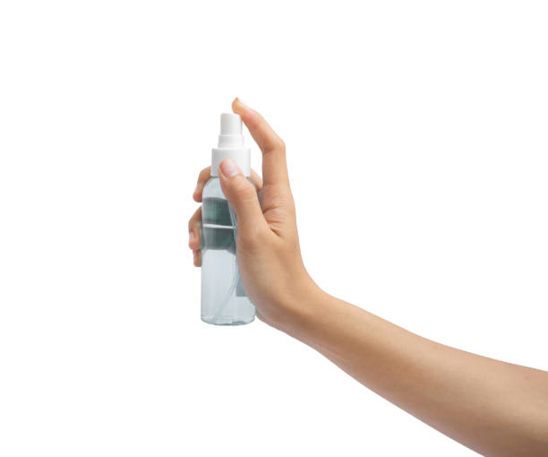 istock Hand applying sanitizer alcohol or anti-bacteria spray in clear plastic bottle isolated on white background. Bacteria and germs clean. Virus protection. Medical and healthcare. Hygiene. Coronavirus 1331051709
