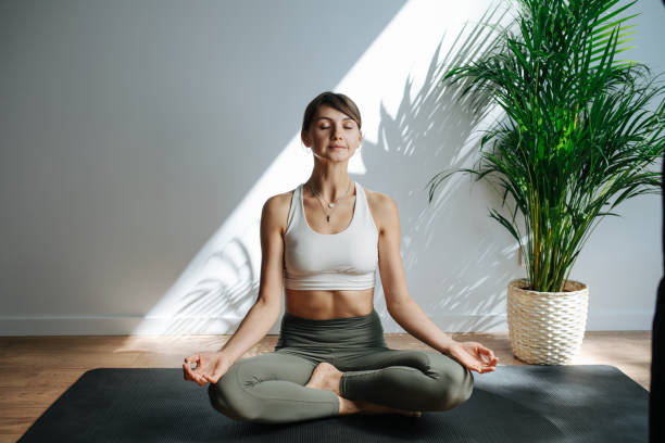 istock Relaxed 30 year old woman practicing yoga, meditating. Frontal view 1331054070
