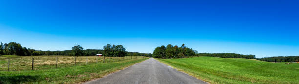 istock Rural web banner - empty country road 1331054571
