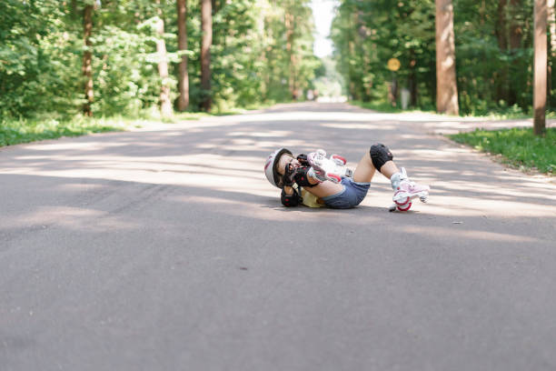 istock cute kid girl learning to roller skate 1331056638